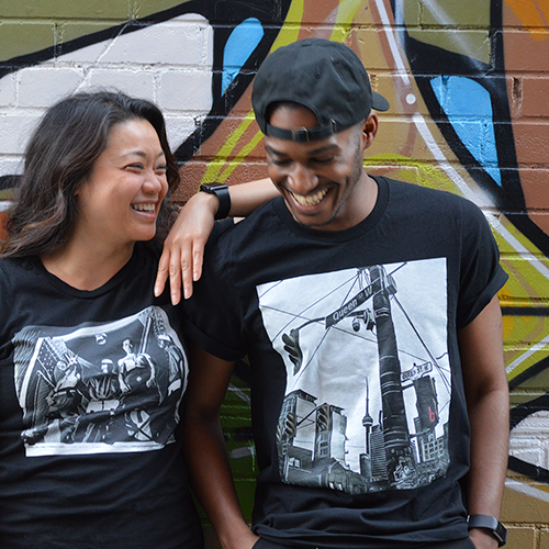 Two people wearing t-shirts from the Nuthin' But a Tee Thang store