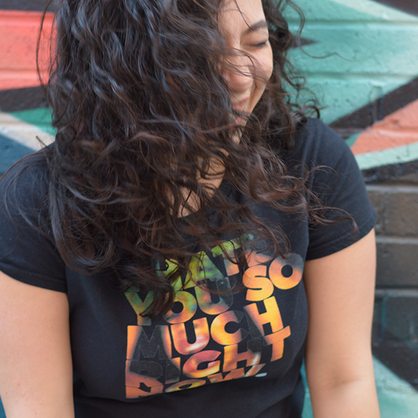 Woman wearing a black t-shirt with a design from the Nuthin' But a Tee Thang shop.